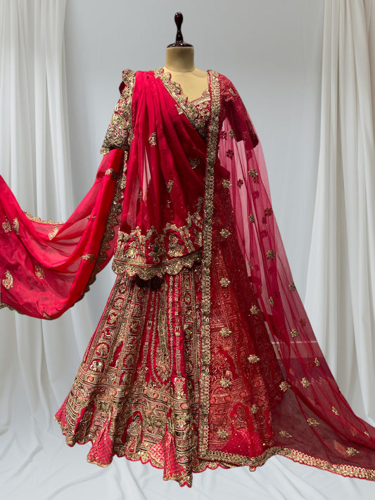 RANI/MAGENTA COLOR BRIDAL SILK LEHENGA WITH READYMADE BLOUSE, TWO DUPATTA ONE IN NET & OTHER IN ORGANZA PAIRED WITH BELT &  TASSELS THIS BEAUTIFUL WEDDING LEHENGA IS EMBELLISHED WITH INTRICATE AARI ZARI, BEADS & SEQUINS WORK