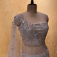 ( DELIVERY IN 25 DAYS ) GREY COLOR NET EMBROIDERED LEHENGA WITH UNSTITCHED BLOUSE EMBELLISHED WITH ZARI & SEQUINS WORK