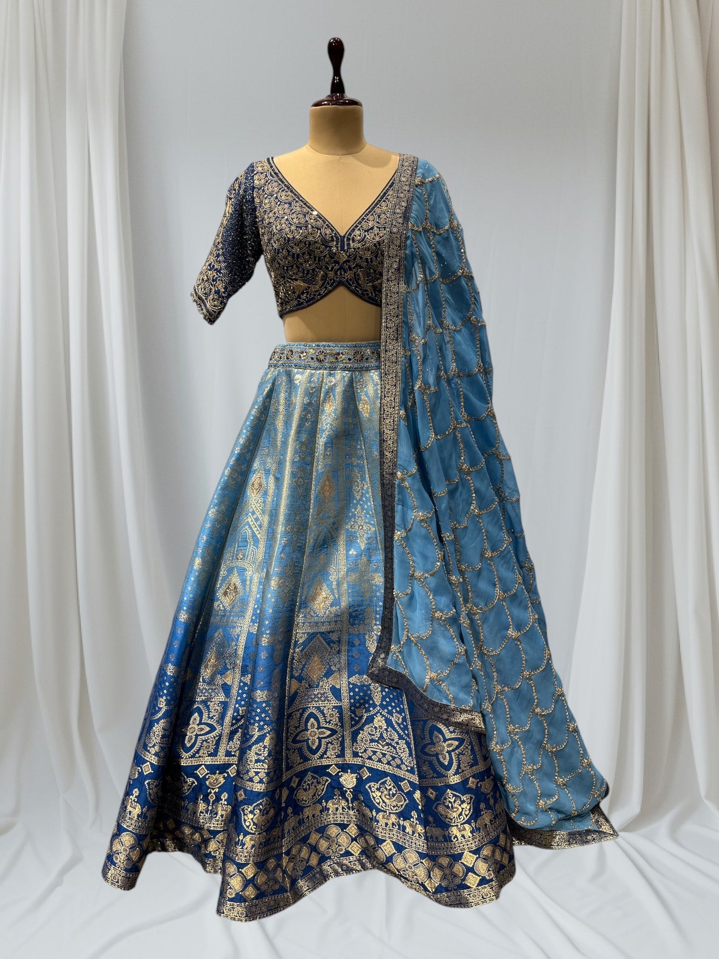 BLUE SHADED BANARASI SILK LEHENGA WITH V-NECK EMBROIDERED BLOUSE & CHIFFON EMBROIDERED DUPATTA