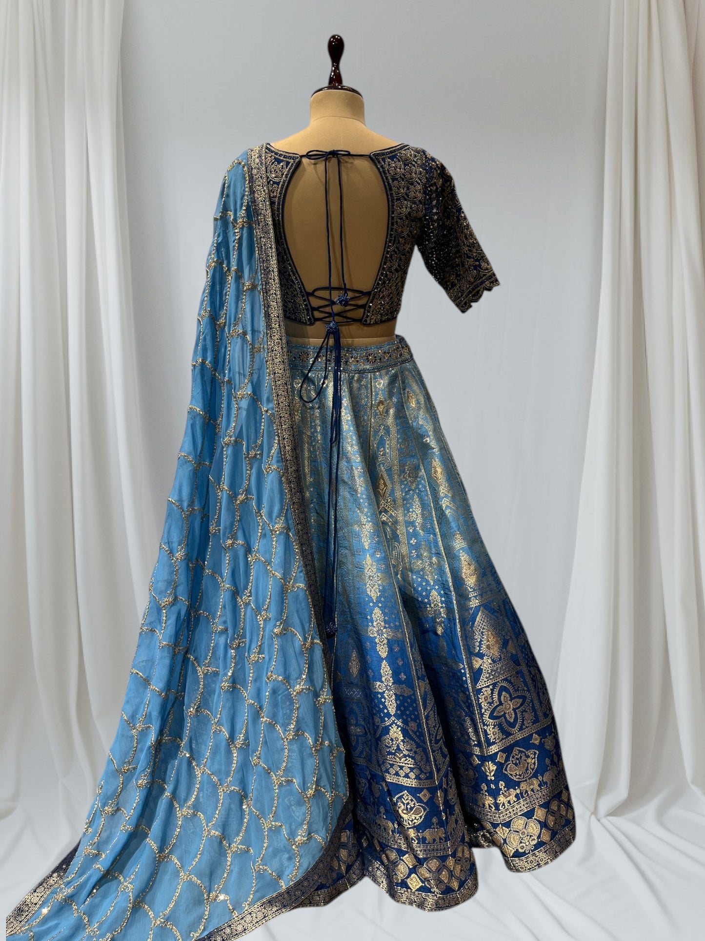 BLUE SHADED BANARASI SILK LEHENGA WITH V-NECK EMBROIDERED BLOUSE & CHIFFON EMBROIDERED DUPATTA