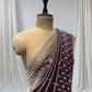 DUSTY WINE COLOR, GEOGETTE TISSUE SAREE WITH SEQUINS, PEARL & CUTDANA EMBROIDERY, PAISLEY MOTIFS ARE PLACED ON  SHOULDER AND PALLA.