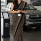 BLACK COLOUR PRINTED SYNTHETIC SAREE WITH UNSTITCHED BLOUSE FOR DRESS CODE - Kothari Sons