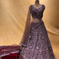 MAUVE COLOUR NET EMBROIDERED LEHENGA WITH CROP TOP BLOUSE EMBELLISHED WITH RESHAM & STONE WORK