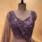 MAUVE COLOUR NET EMBROIDERED LEHENGA WITH CROP TOP BLOUSE EMBELLISHED WITH RESHAM & STONE WORK