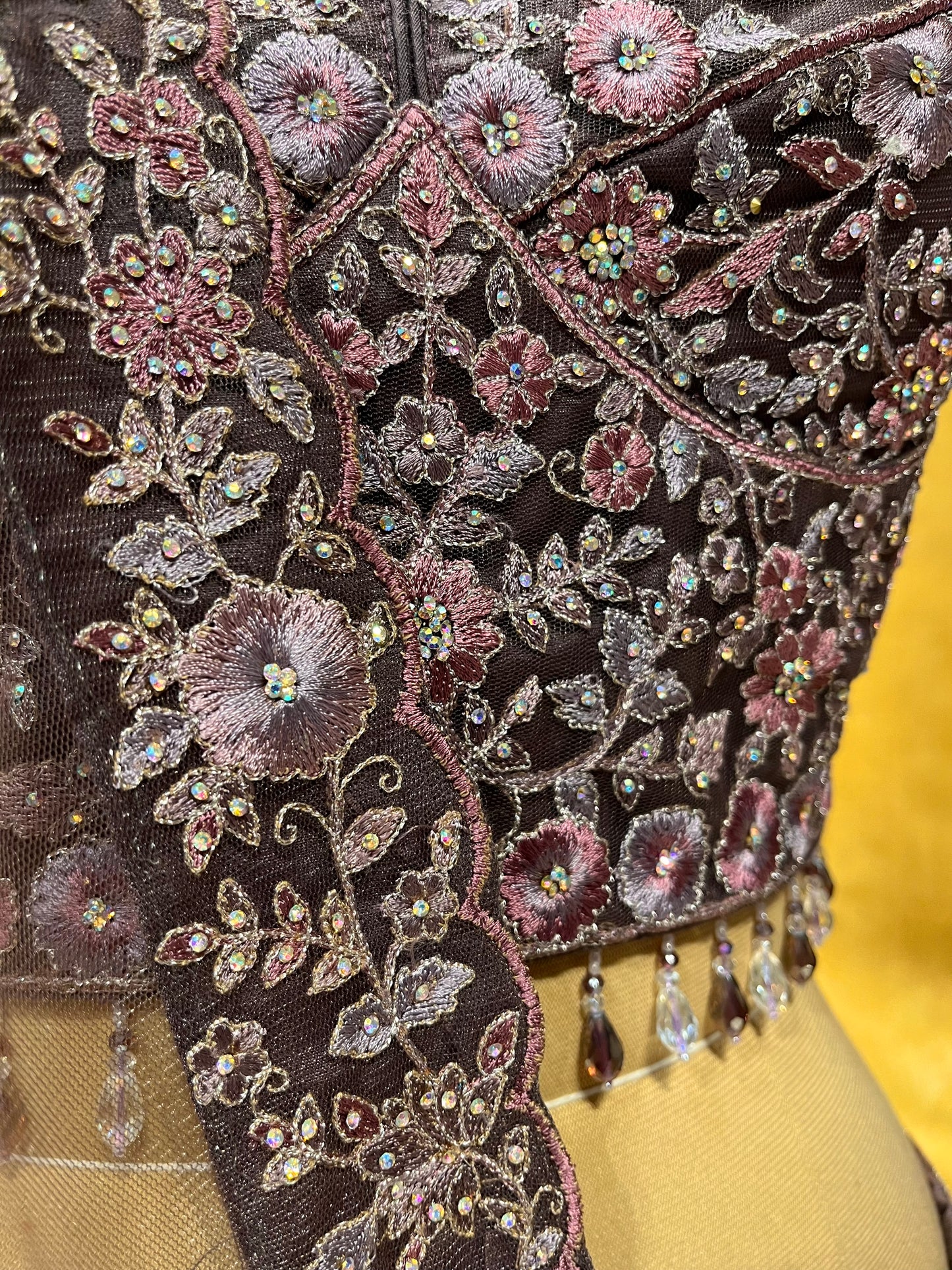 MAUVE COLOUR NET EMBROIDERED LEHENGA WITH CROP TOP BLOUSE EMBELLISHED WITH RESHAM & STONE WORK