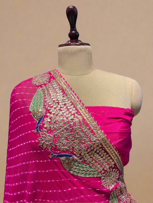 (Deliver in 30 Days) HOT PINK PURE MOTHRA LEHERIYA SAREE WITH GOTA PATTI & ZARDOZI WORK BORDER PAIRED WITH A CREPE BLOUSE