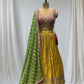 MUSTARD YELLOW SILK LEHENGA WITH SEQUINS  & BEADED V-NECK CROP TOP WITH GREEN DUPATTA