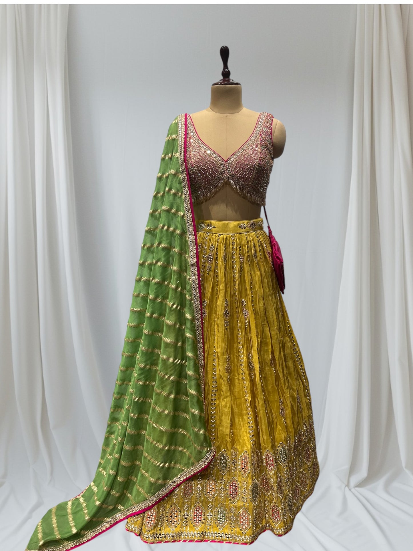 MUSTARD YELLOW SILK LEHENGA WITH SEQUINS  & BEADED V-NECK CROP TOP WITH GREEN DUPATTA