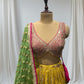 MUSTARD YELLOW SILK LEHENGA WITH SEQUINS  & BEADED V-NECK CROP TOP WITH GREEN DUPATTA