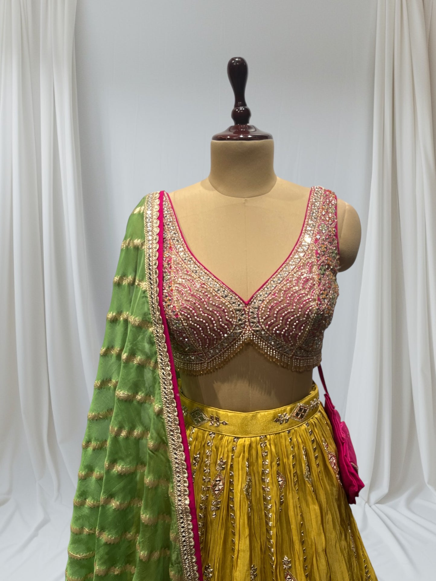 MUSTARD YELLOW SILK LEHENGA WITH SEQUINS  & BEADED V-NECK CROP TOP WITH GREEN DUPATTA