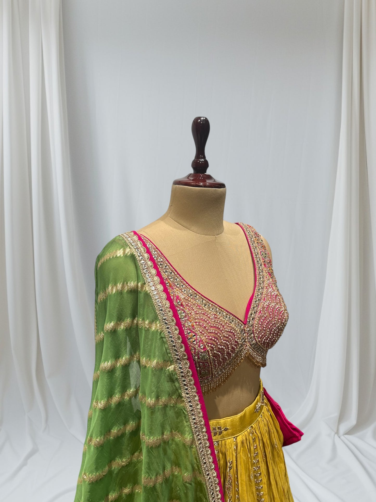 MUSTARD YELLOW SILK LEHENGA WITH SEQUINS  & BEADED V-NECK CROP TOP WITH GREEN DUPATTA