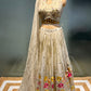 IVORY COLOUR TISSUE SILK LEHENGA WITH READYMADE BLOUSE EMBELLISHED EITH RESHAM & MIRROR WORK