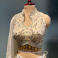 IVORY COLOUR TISSUE SILK LEHENGA WITH READYMADE BLOUSE EMBELLISHED EITH RESHAM & MIRROR WORK