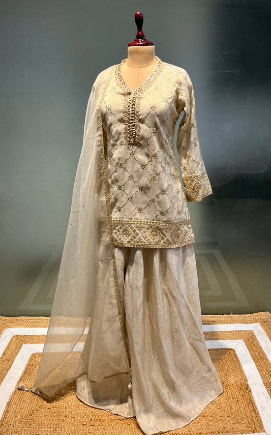 IVORY COLOUR TISSUE SILK SHARARA SUIT WITH ORGANZA DUPATTA EMBELLISHED WITH ZARI & SEQUINS WORK