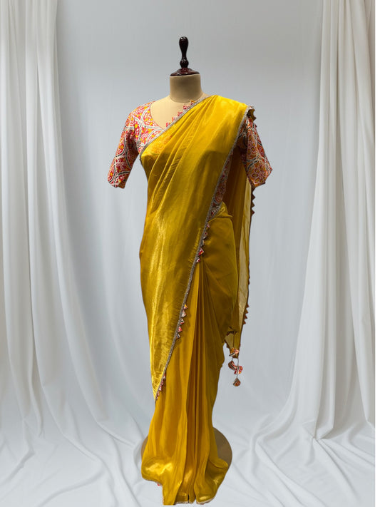 YELLOW SILK TISSUE SAREE WITH PATOLA PINK STITCHED BLOUSE, FEATURING ELEGANT GOTA BORDER, PERFECT FOR FESTIVE AND TRADITIONAL OCCASIONS