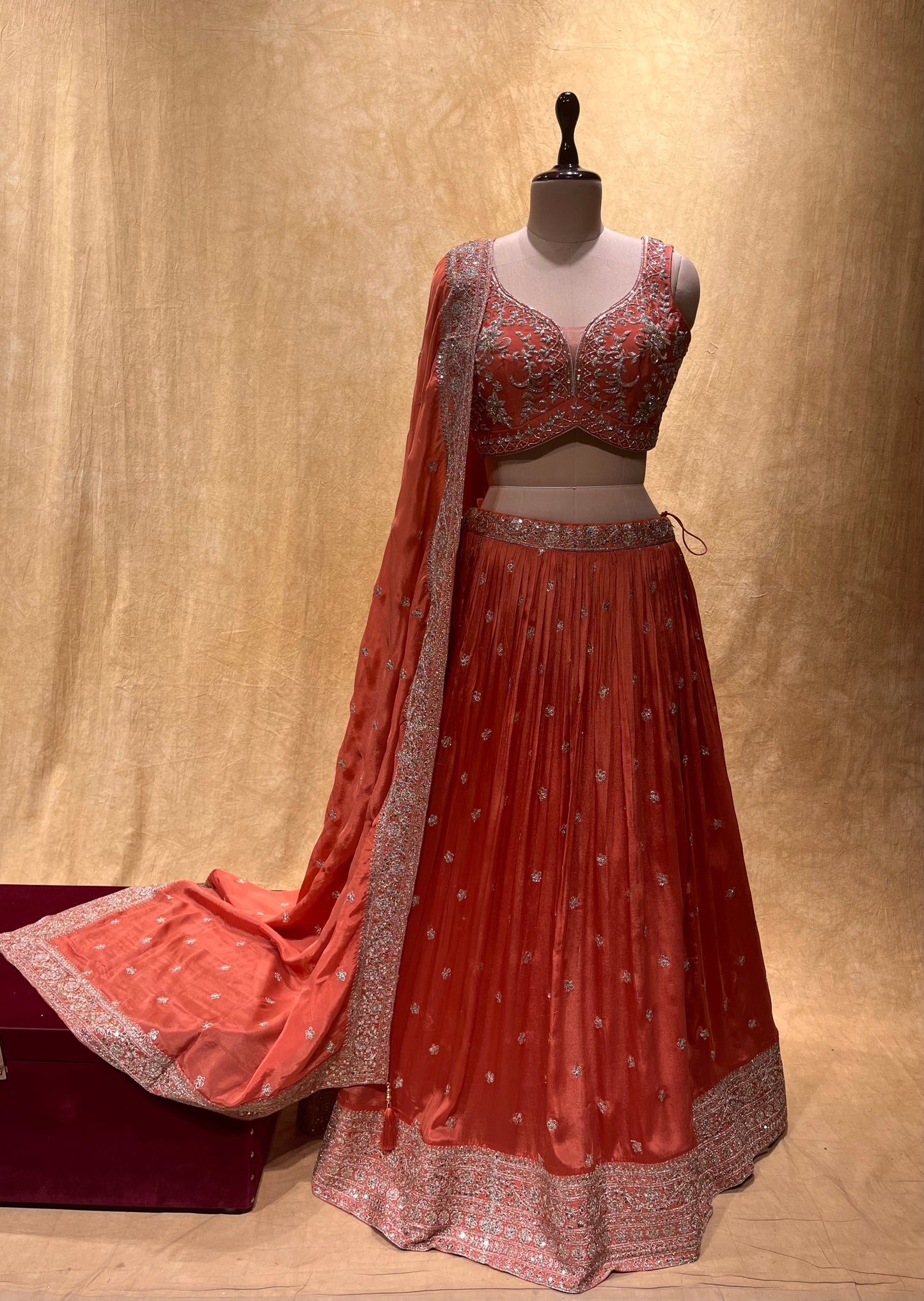 (DELIVERY IN 20-25 DAYS) BRIDESMAIDS READYMADE RUST ORANGE COLOUR CHINON LEHENGA WITH CROP TOP BLOUSE EMBELLISHED WITH ZARI & CUTDANA WORK