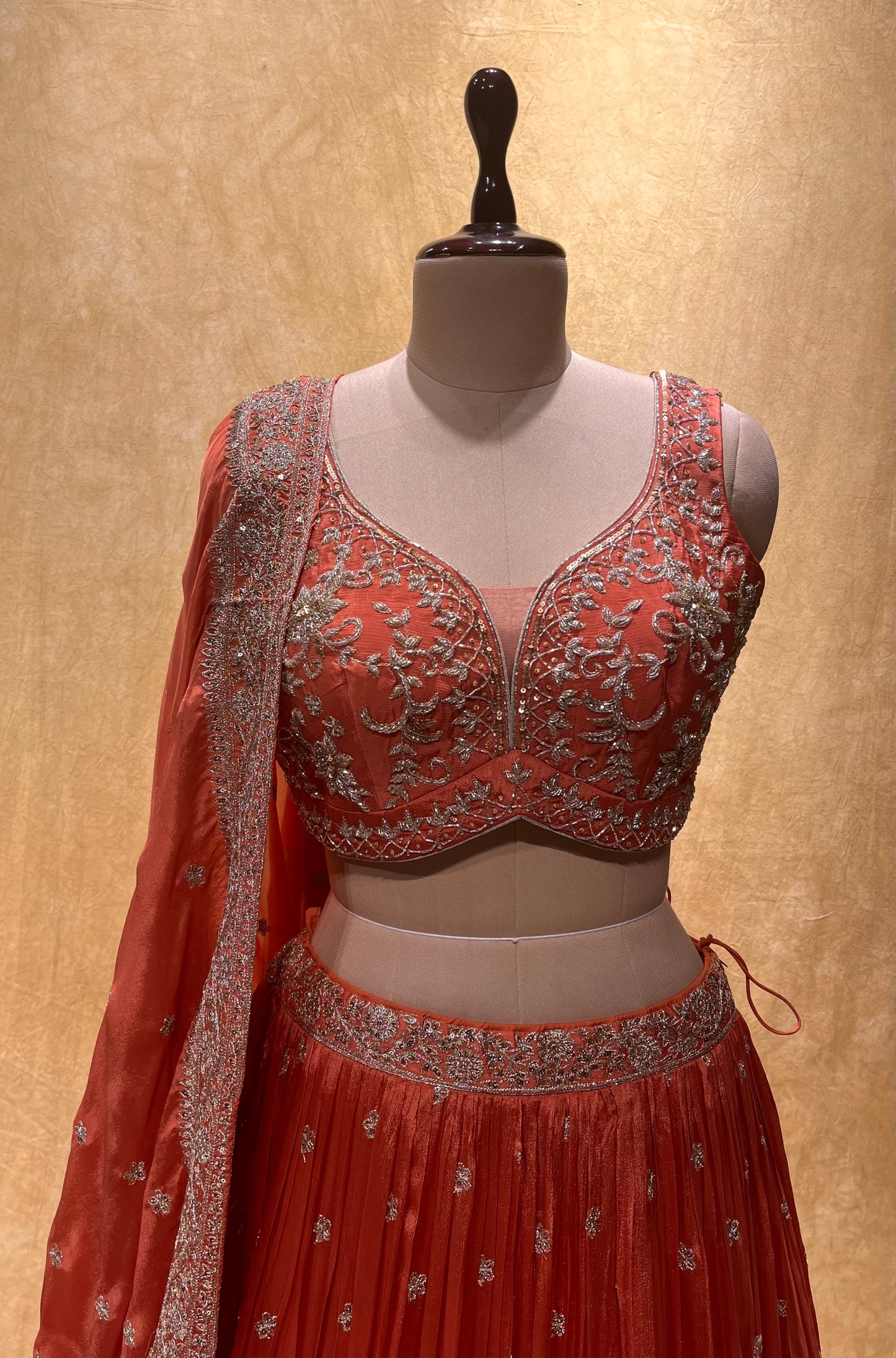 (DELIVERY IN 20-25 DAYS) BRIDESMAIDS READYMADE RUST ORANGE COLOUR CHINON LEHENGA WITH CROP TOP BLOUSE EMBELLISHED WITH ZARI & CUTDANA WORK