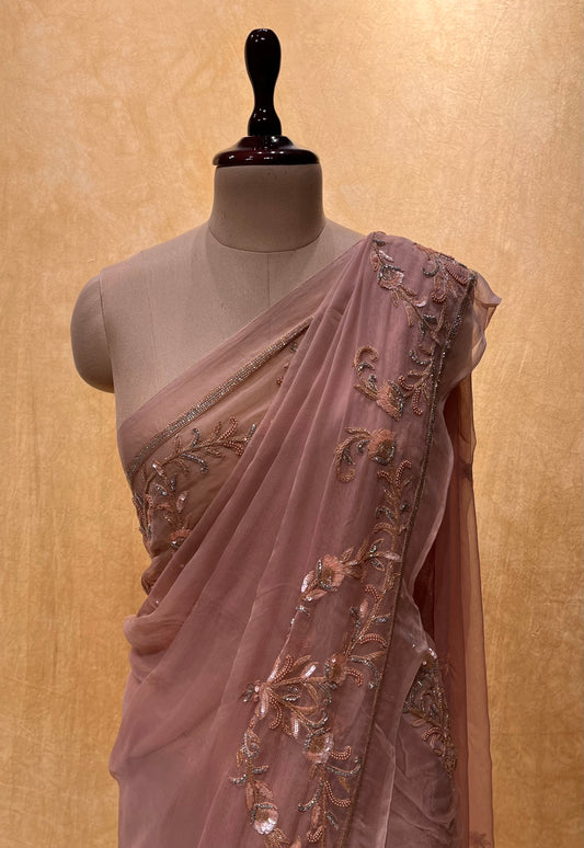 ( DELIVERY IN 25 DAYS ) PEACH COLOUR CHIFFON HAND EMBROIDERED SAREE EMBELLISHED WITH SEQUINS, CUTDANA & BEADS WORK