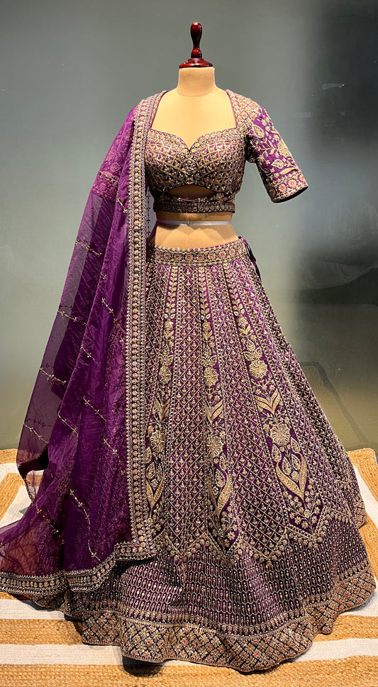 PURPLE COLOUR SILK EMBROIDERED LEHENGA WITH ORGANZA DUPATTA EMBELLISHED WITH ZARI & SEQUINS WORK