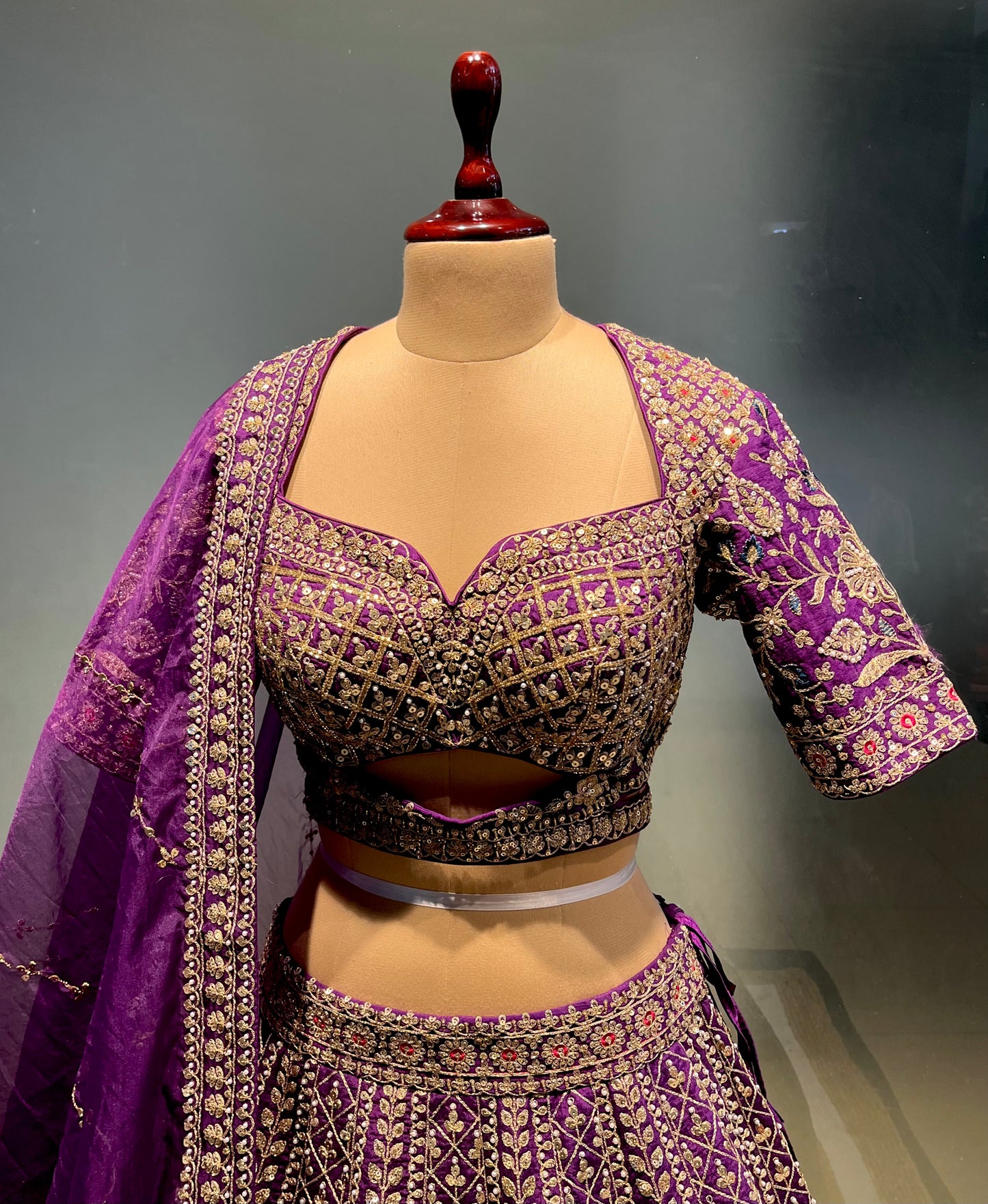 ( DELIVERY IN 20-25 DAYS ) PURPLE COLOUR SILK EMBROIDERED LEHENGA WITH ORGANZA DUPATTA EMBELLISHED WITH ZARI & SEQUINS WORK