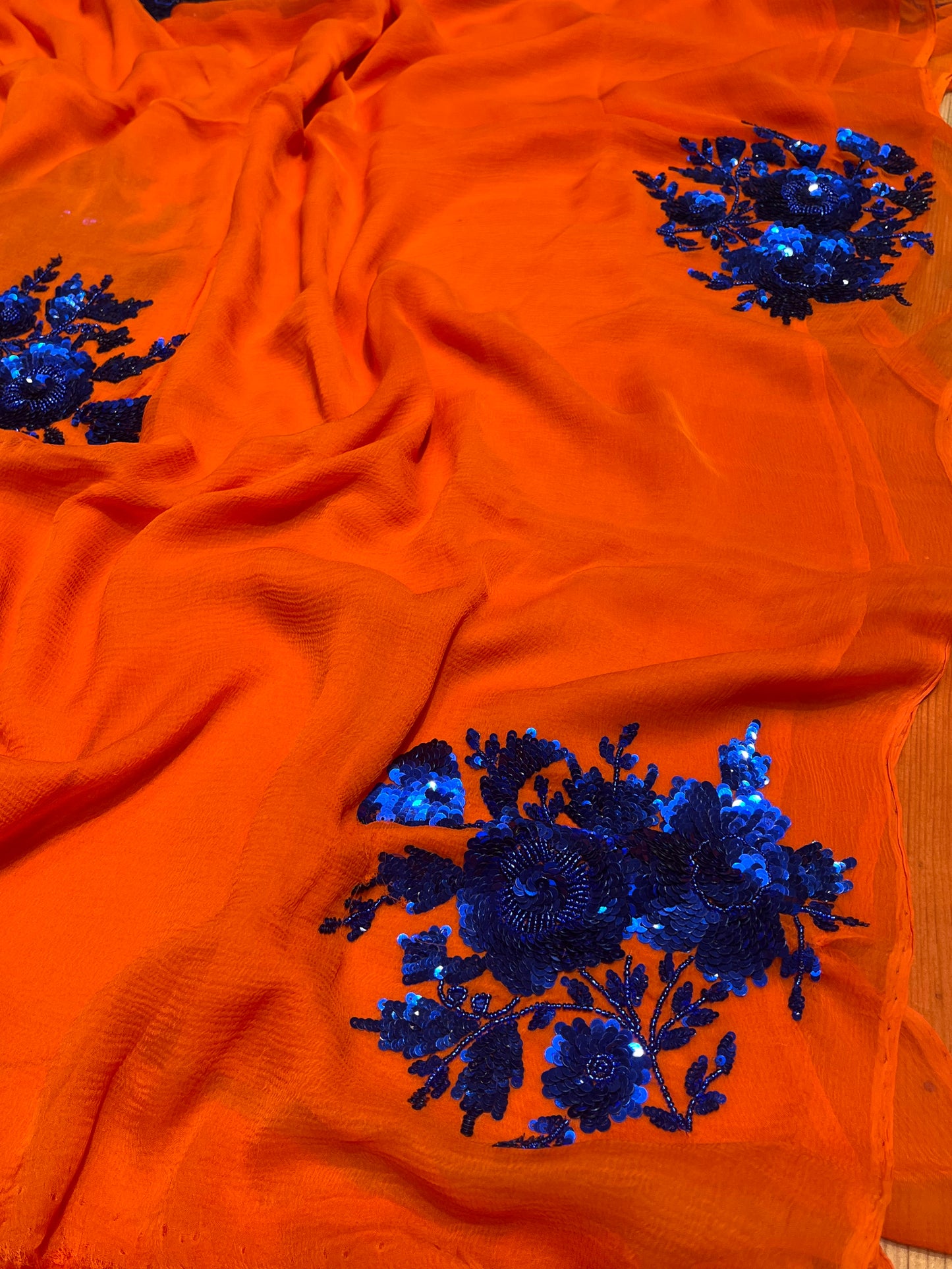 ( DELIVERY IN 20-25 DAYS ) ORANGE COLOUR CHIFFON HAND EMBROIDERED SAREE EMBELLISHED WITH SEQUINS WORK