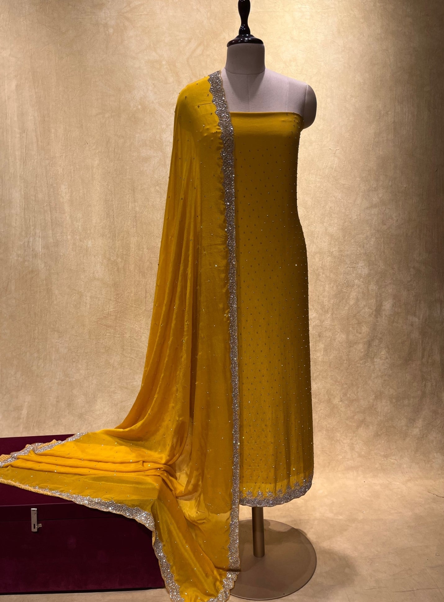 YELLOW COLOUR CREPE SILK UNSTITCHED EMBROIDERED SUIT EMBELLISHED WITH CUTDANA & STONE WORK