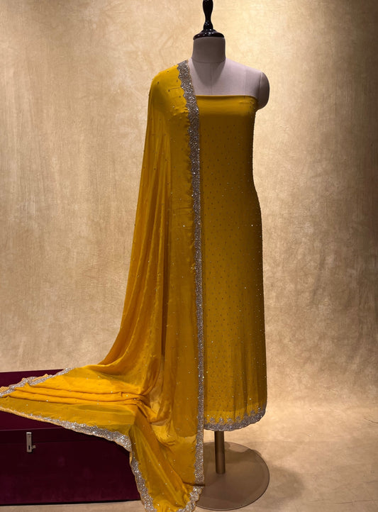 YELLOW COLOUR CREPE SILK UNSTITCHED EMBROIDERED SUIT EMBELLISHED WITH CUTDANA & STONE WORK