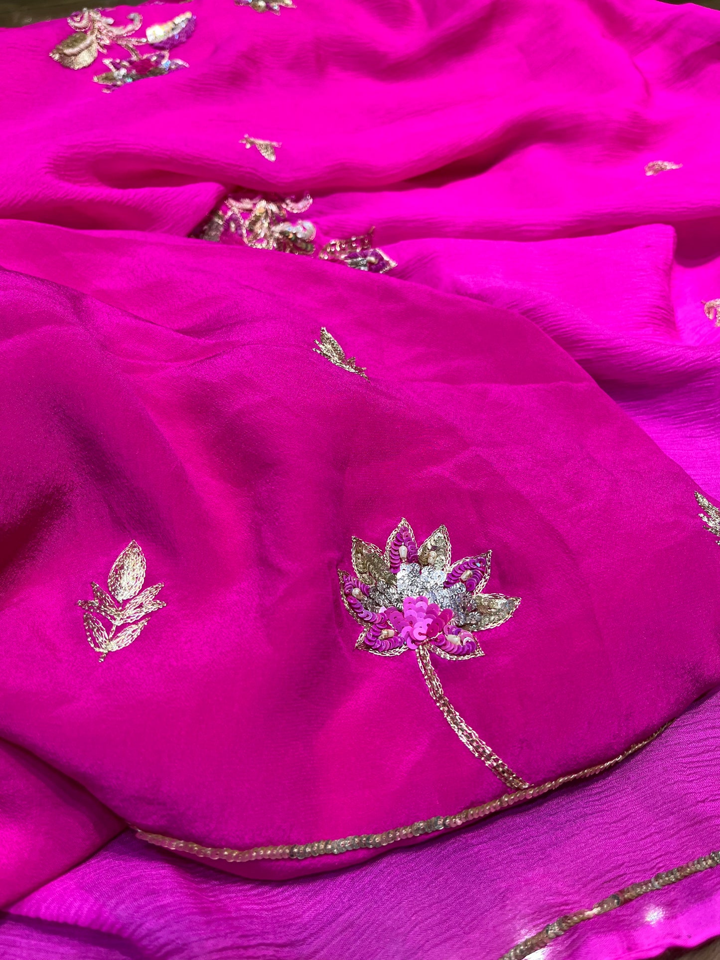 FUCHSIA PINK SHADED CHIFFON HAND EMBROIDERED SAREE WITH CREPE SILK BLOUSE EMBELLISHED WITH AARI, SEQUINS & CUTDANA WORK