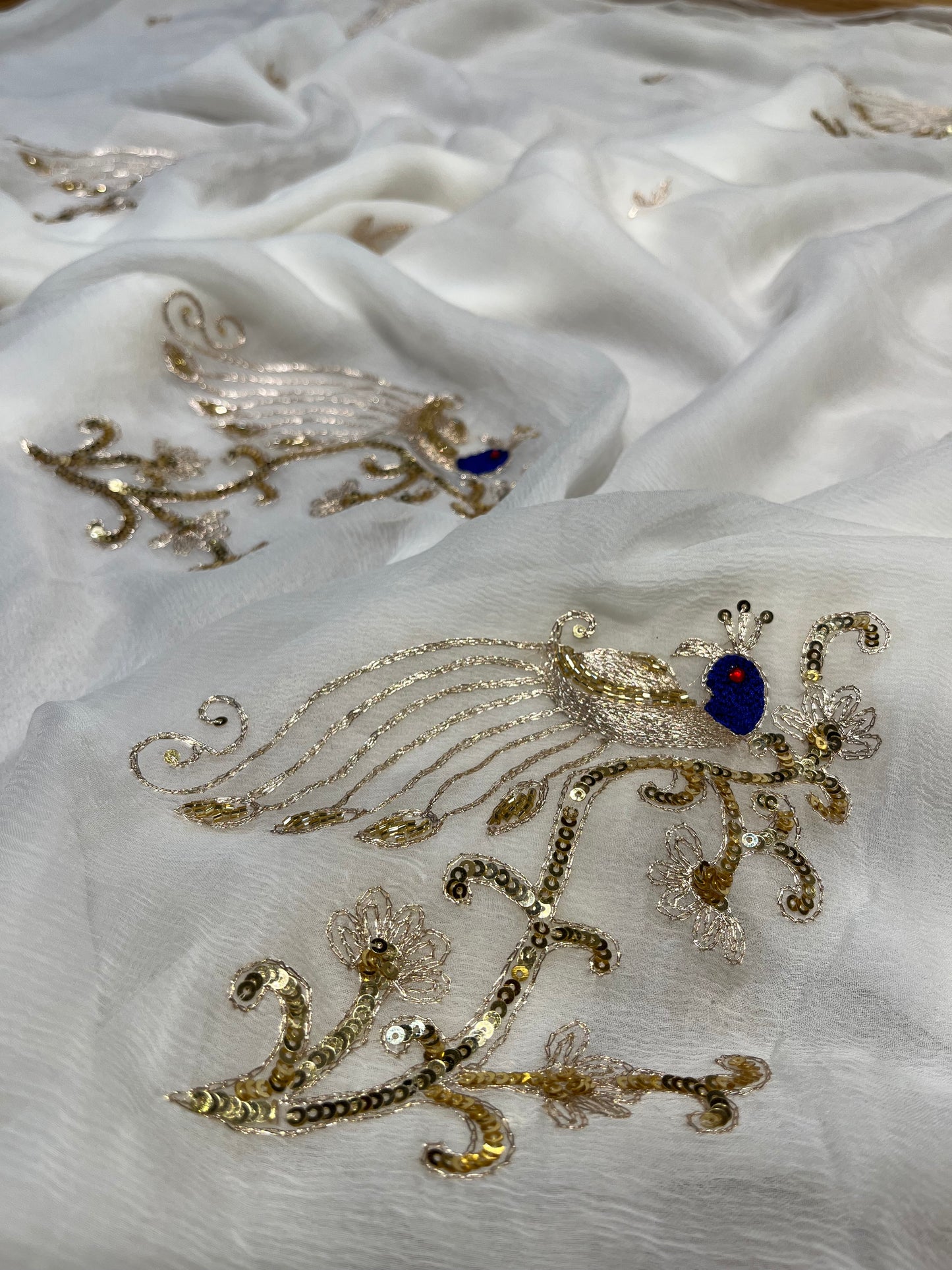 WHITE COLOUR EMBROIDERED CHIFFON SAREE WITH CHINON BLOUSE EMBELLISHED WITH AARI & SEQUINS WORK
