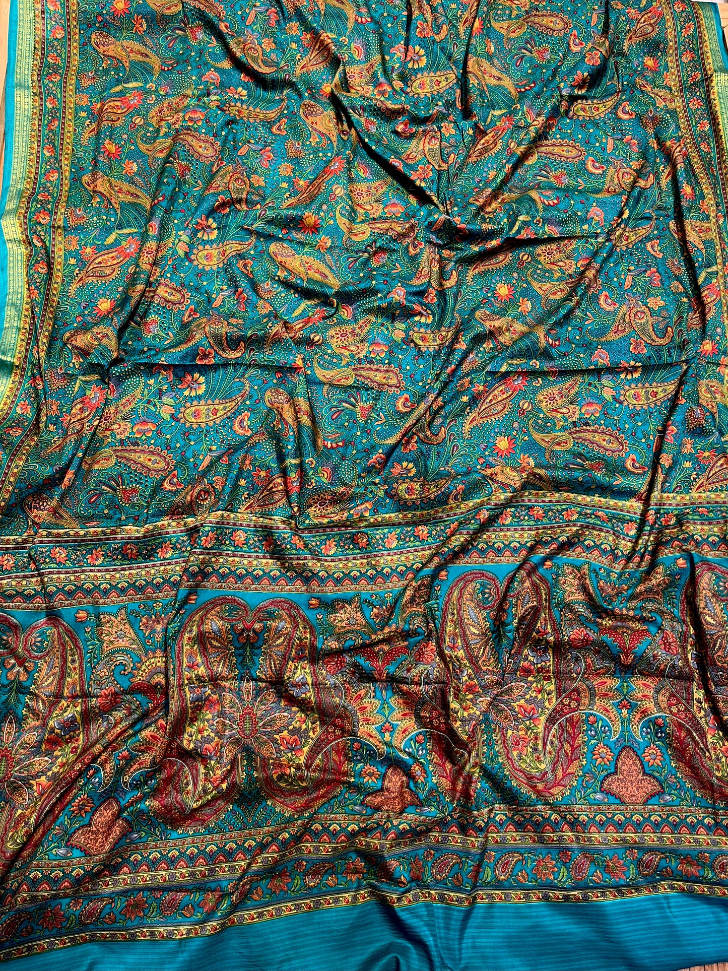 TEAL COLOUR ART CREPE SILK PRINTED SAREE WITH ZARI BORDER (DELIVERY TIME 15 DAYS)