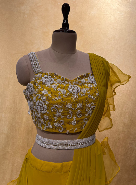 YELLOW COLOUR GEORGETTE LEHENGA WITH EMBROIDERED BLOUSE WITH RUFFLE ATTACHED DUPATTA EMBELLISHED WITH PEARL WORK