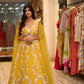 YELLOW COLOUR NET HAND EMBROIDERED SKIRT WITH DESIGNER CTOP TOP BLOUSE EMBELLISHED WITH SEQUINS, CUTDANA & PEARL WORK