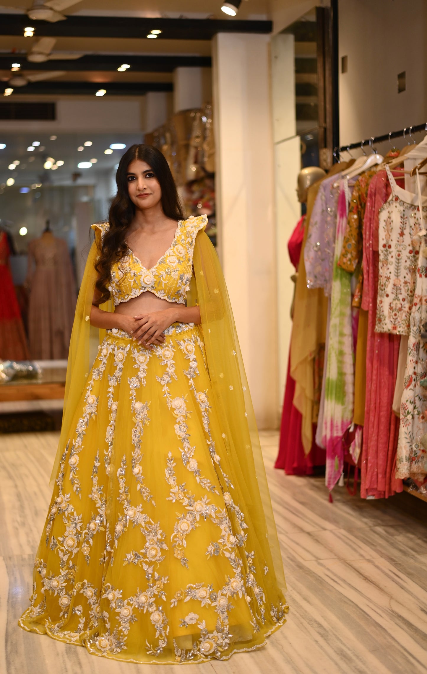 YELLOW COLOUR NET HAND EMBROIDERED SKIRT WITH DESIGNER CTOP TOP BLOUSE EMBELLISHED WITH SEQUINS, CUTDANA & PEARL WORK