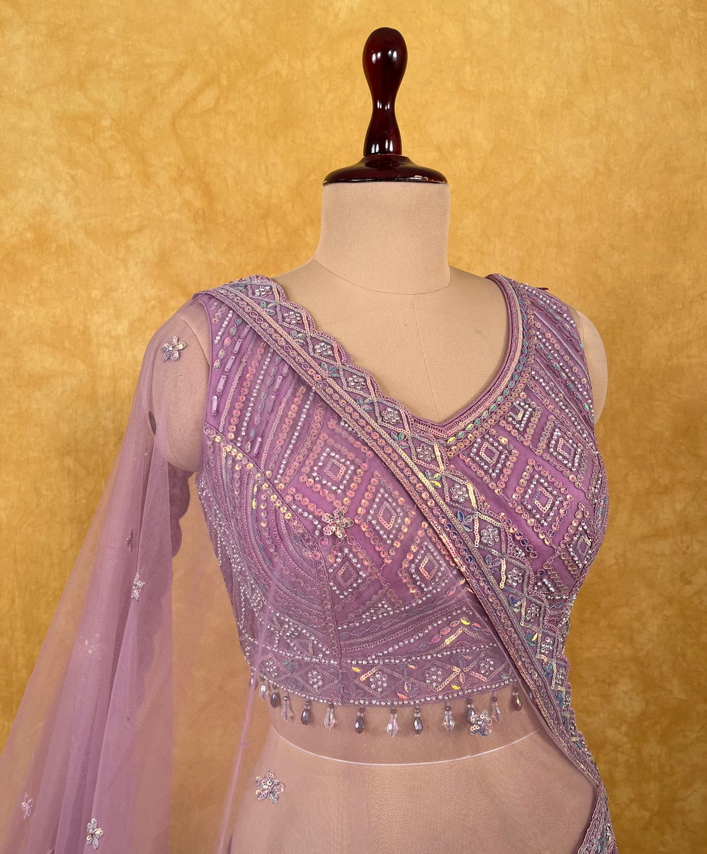 LAVENDER COLOUR NET EMBROIDERED LEHENGA WITH READYMADE BLOUSE EMBELLISHED WITH SEQUINS WORK