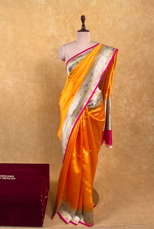 ORANGE COLOUR PURE SILK SAREE WITH CONTRAST BORDER EMBELLISHED WITH ZARI WEAVES