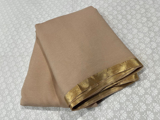 ( DELIVERY IN 25 DAYS ) BEIGE COLOUR PURE CHIFFON SAREE WITH ZARI BORDER