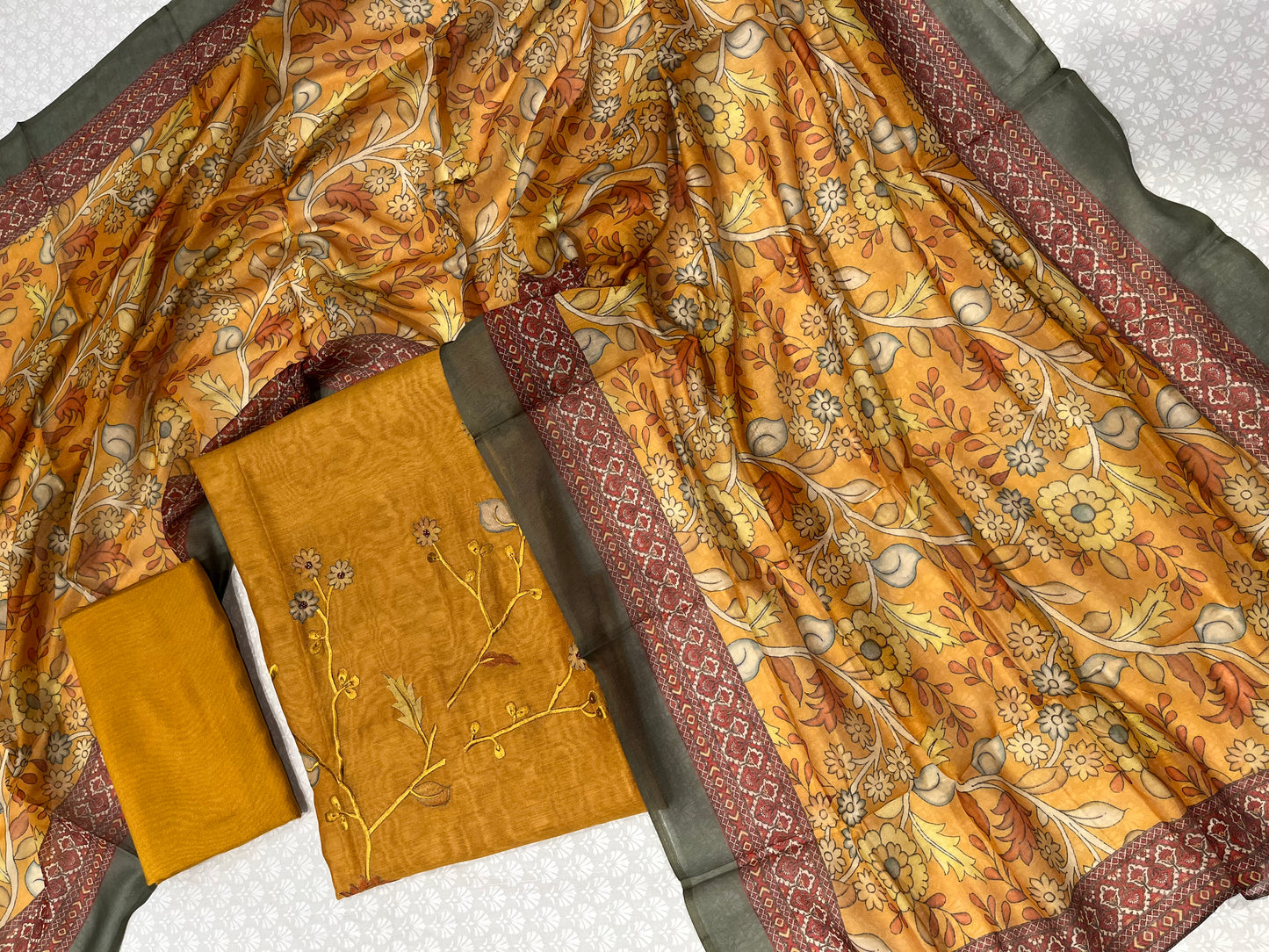 MUSTARD COLOUR CHANDERI UNSTITCHED SUIT WITH PRINTED DUPATTA EMBELLISHED WITH RESHAM EMBROIDERY