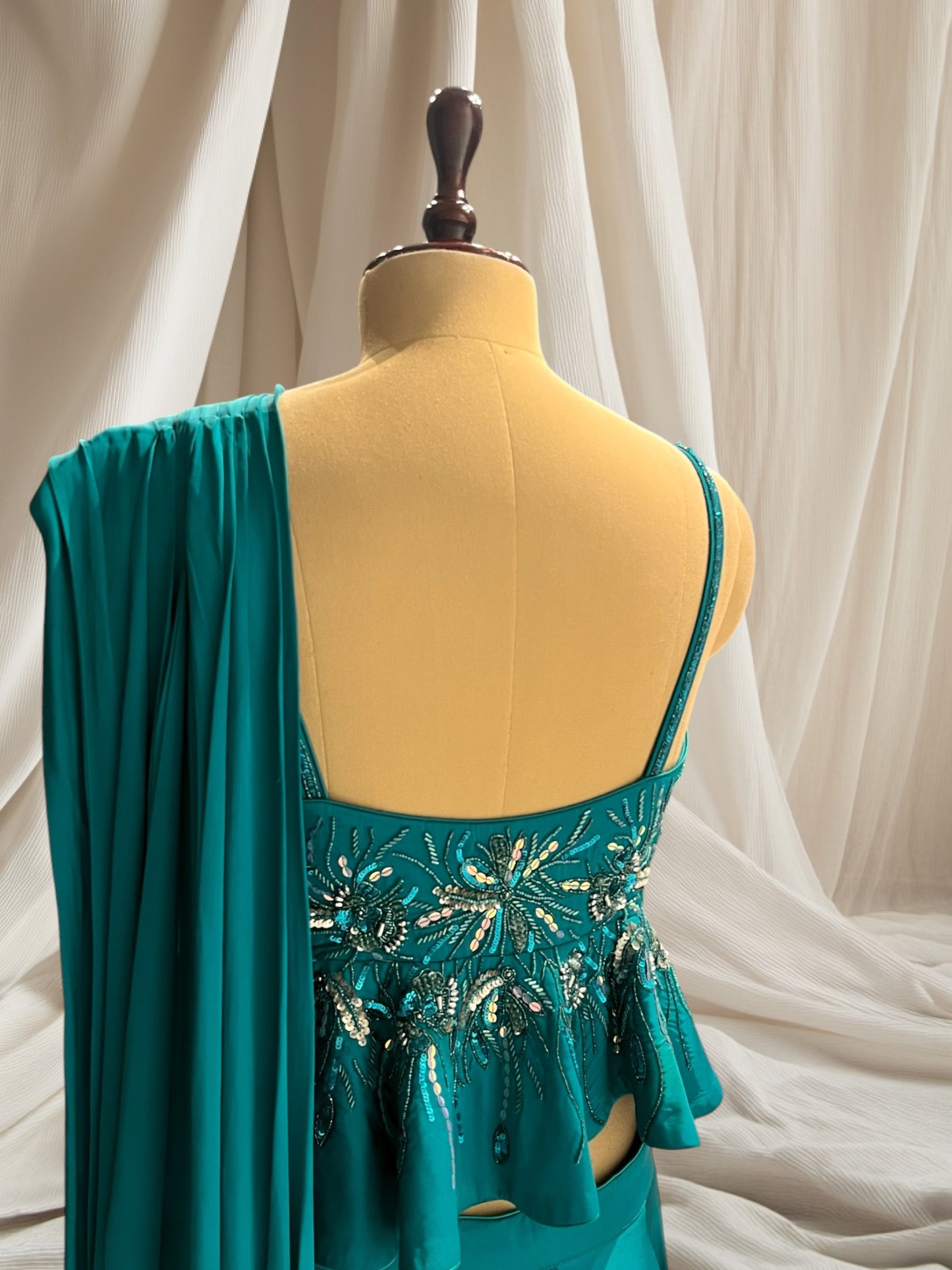 TURQUOISE COLOUR SATIN SILK INDOWESTERN DRESS PEPLUM TOP WITH ATTACH DUPATTA SKIRT EMBELLIESHED WITH CUTDANA, BEADS & SEQUINS WORK