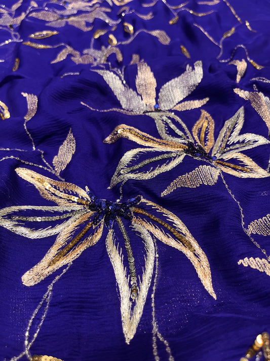 ( DELIVERY IN 20-25 DAYS ) BLUE COLOUR PURE CHIFFON HAND EMBROIDERED SAREE EMBELLISHED WITH AARI, SEQUINS & CUTDANA WORK