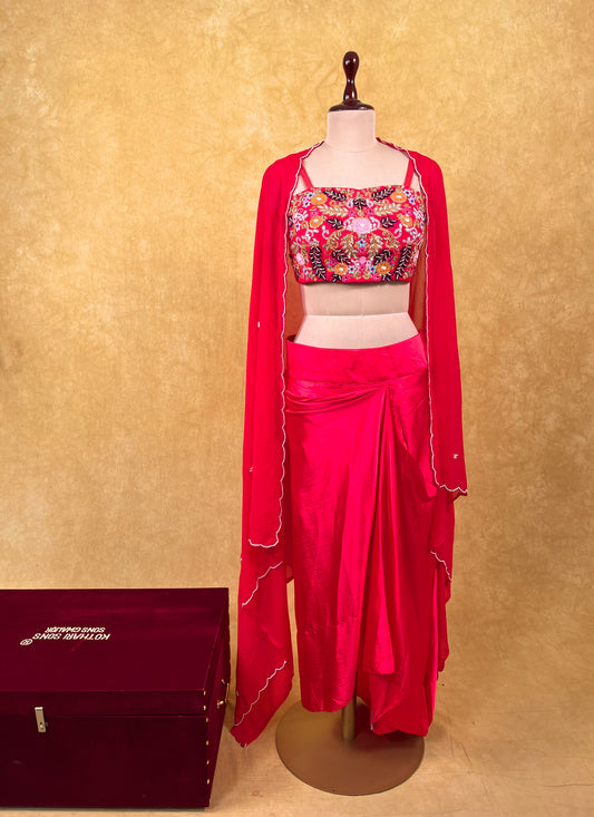HOT PINK COLOUR SATIN SILK DRAPE SKIRT WITH EMBROIDERED BLOUSE & GEORGETTE SHRUG EMBELLISHED WITH ZARDOZI, SEQUINS & THREAD WORK