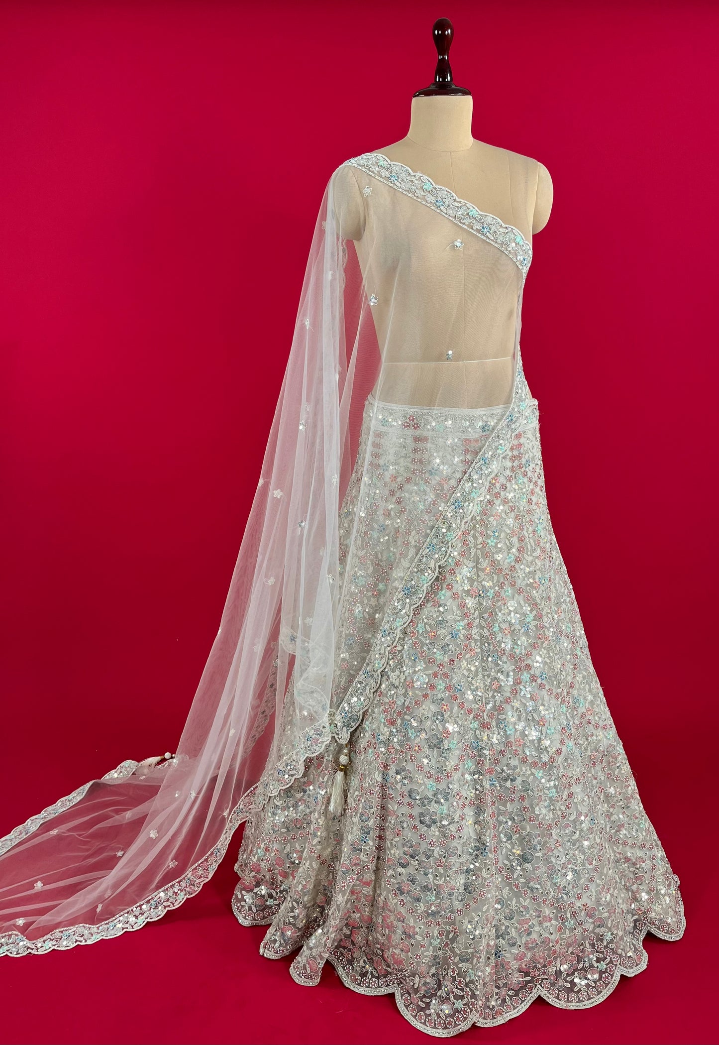 WHITE COLOUR NET SEQUINS EMBROIDERED LEHENGA WITH UNSTITCHED BLOUSE & NET DUPATTA EMBELLISHED WITH SEQUINS WORK