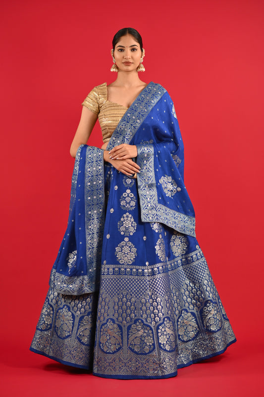 ( DELIVERY IN 25 DAYS ) BLUE COLOUR BANARASI SILK LEHENGA WITH UNSTITCHED BLOUSE EMBELLISHED WITH ZARI WEAVES