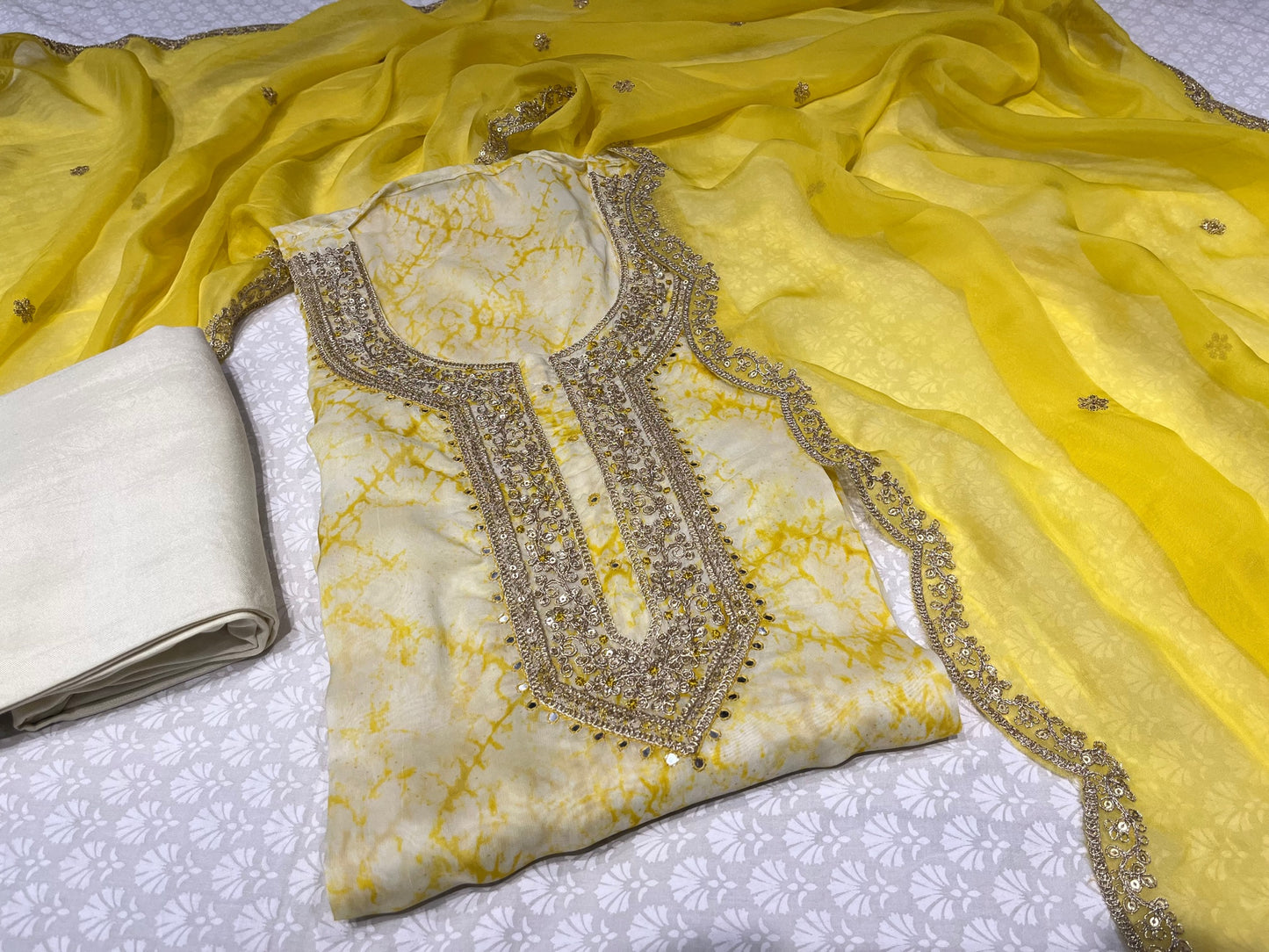 YELLOW COLOUR ORGANZA UNSTITCHED SUIT EMBELLISHED WITH MIRROR & ZARI WORK