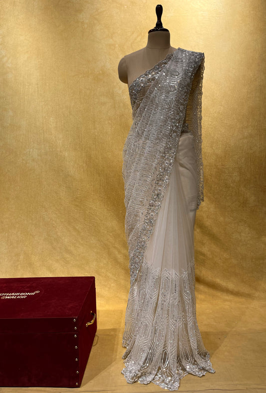 WHITE COLOR NET EMBROIDERED SAREE EMBELLISHED WITH SEQUINS & STONE WORK ( STYLISH PARTY WEAR NET SAREE )