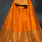 ( DELIVERY IN 25 DAYS ) ORANGE COLOUR BANARASI SILK LEHENGA EMBELLISHED WITH ZARI WEAVES