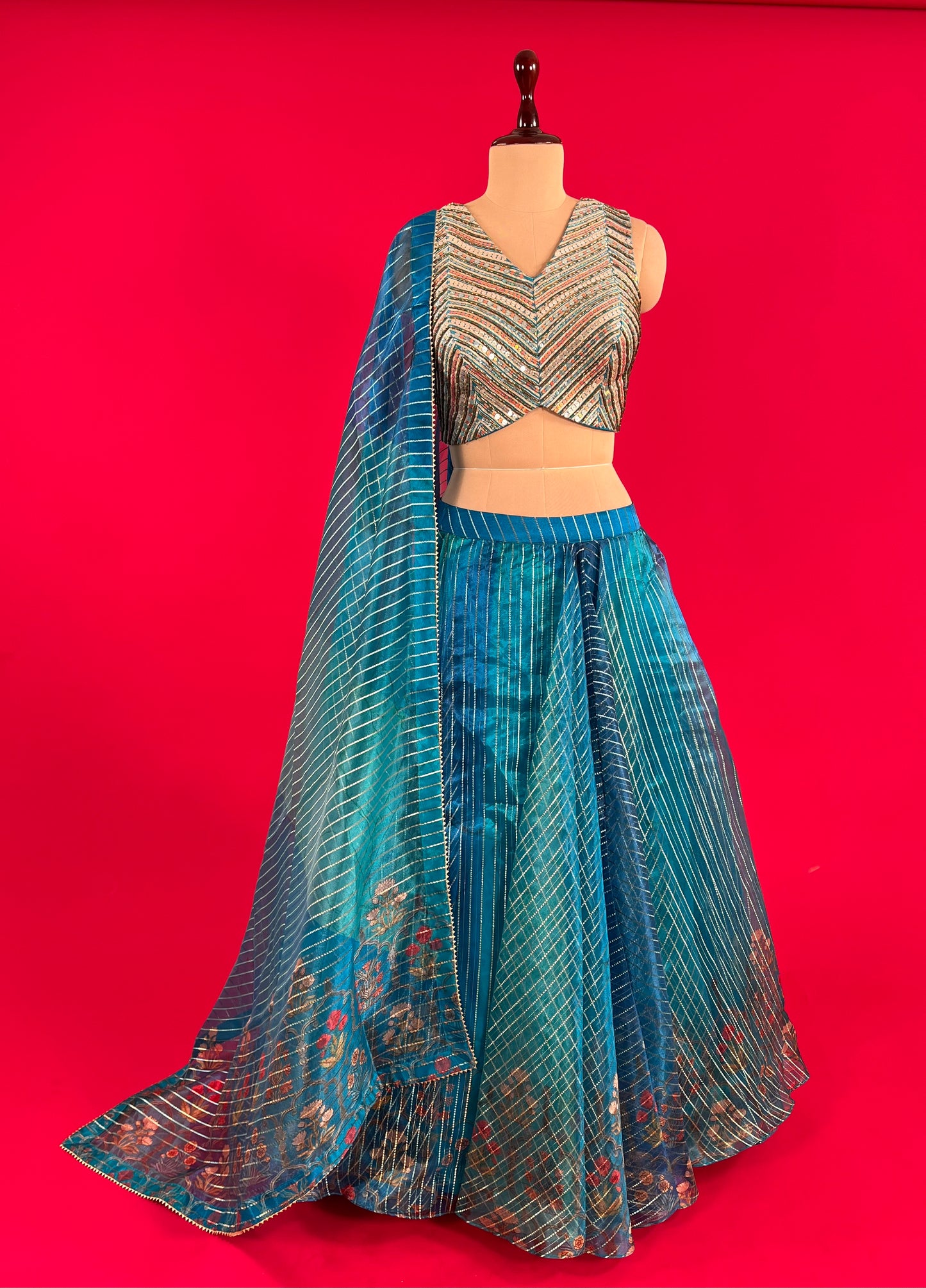 ( DELIVERY IN 25 DAYS ) PEACOCK GREEN COLOUR ORGANZA SKIRT WITH READYMADE BLOUSE EMBELLISHED WITH SEQUINS & BEADS WORK