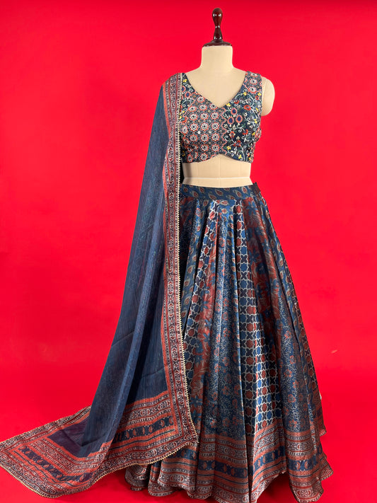 BLUE COLOUR KALAMKARI PRINT ORGANZA SKIRT WITH READYMADE CROP TOP EMBELLISHED WITH RESHAM EMBROIDERY