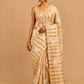 IVORY COLOUR CHANDERI GOLDEN STRIPED PARSI EMBROIDERED SAREE PAIRED WITH AN UNSTITCHED GOLDEN BLOUSE BY SIDDHAIKA - Kothari Sons
