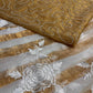 IVORY COLOUR CHANDERI GOLDEN STRIPED PARSI EMBROIDERED SAREE PAIRED WITH AN UNSTITCHED GOLDEN BLOUSE BY SIDDHAIKA - Kothari Sons