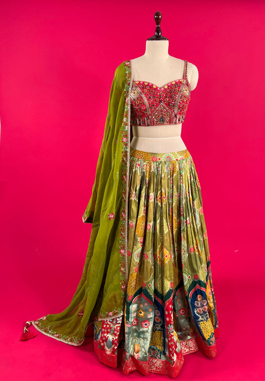 ( DELIVERY IN 25 DAYS ) MEHANDI GREEN COLOUR SKIRT WITH EMBROIDERED CROP TOP BLOUSE & ORGANZA DUPATTA EMBELLISHED WITH RESHAM, CUTDANA & SEQUINS WORK